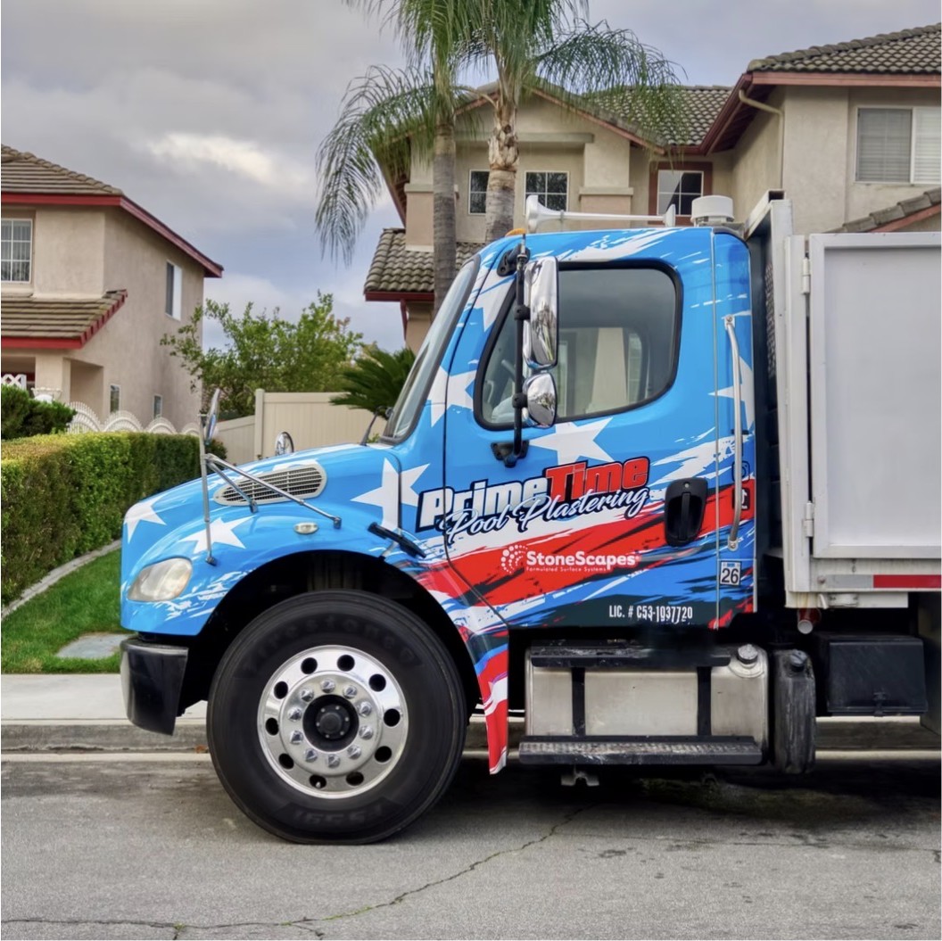 Prime Time Pool Plastering branded work truck parked in a residential neighborhood