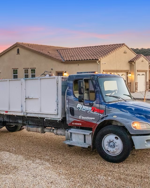 Prime Time Pool Plastering work truck parked at a job site